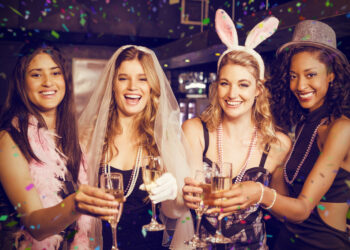 Friends celebrating bachelorette party against flying colours