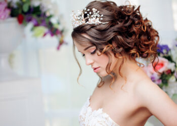 Portrait of a beautiful girl in a wedding dress. Bride in luxurious dress, close-up